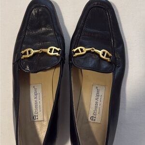 Etienne Aigner Black Leather Slip-Ons with Gold Detail